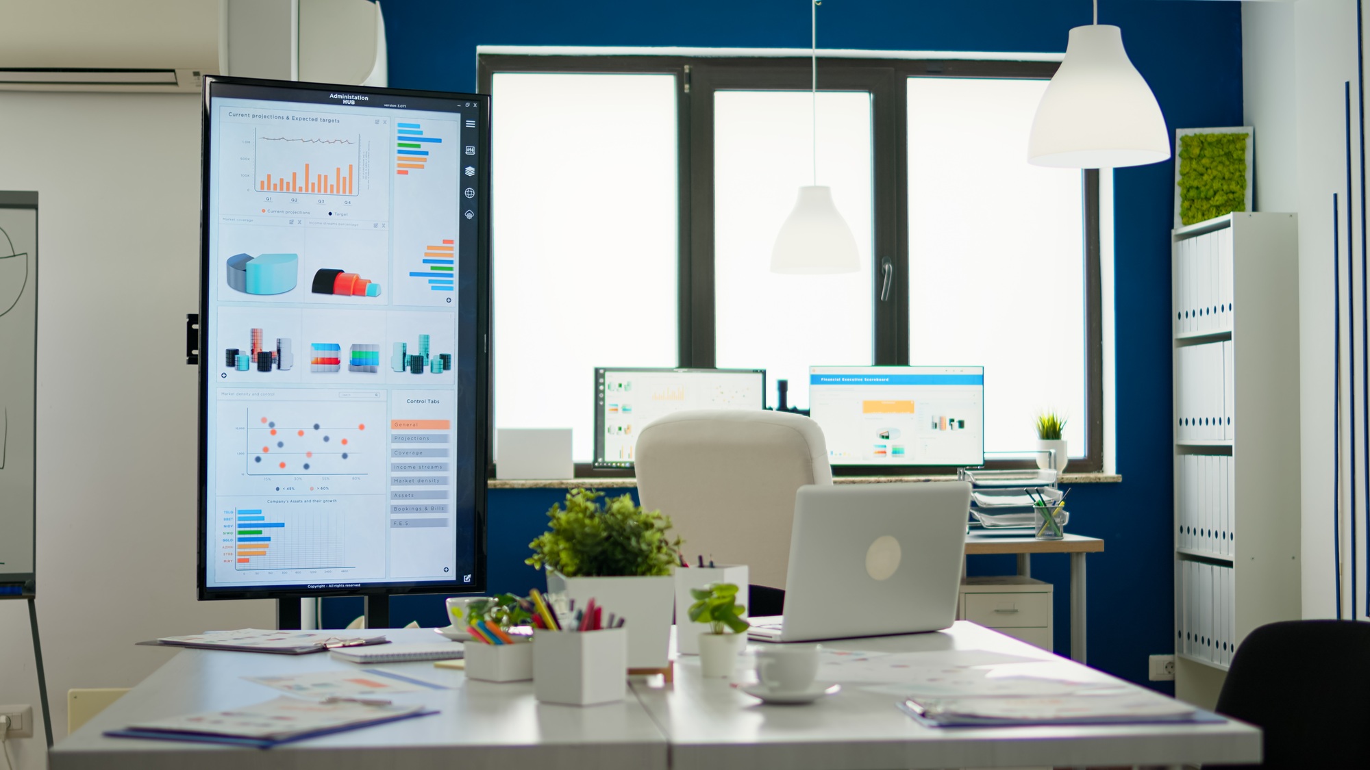 Bright business office desk ready for morning meeting with financial charts